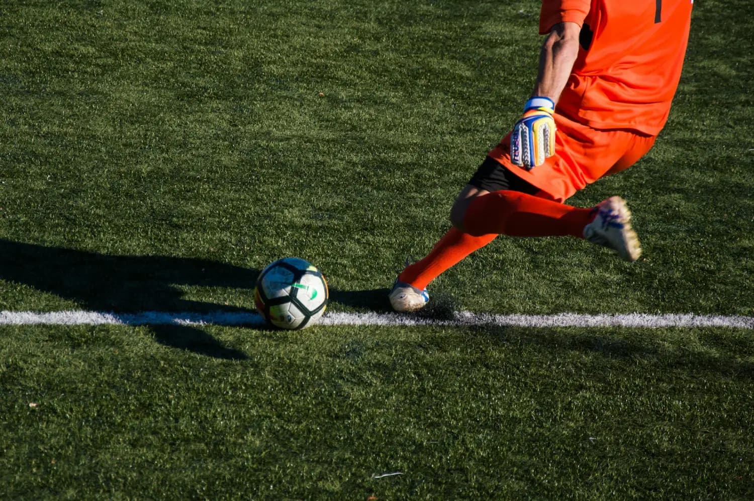 Football players competing on a sports field