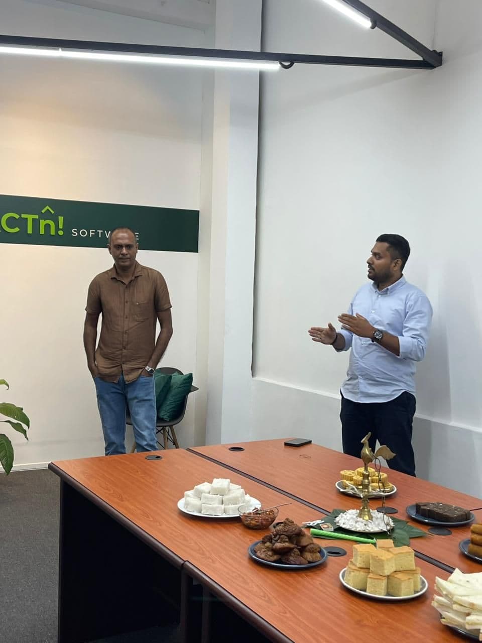 FACTn founders speaking during the first day of 2026 office celebration