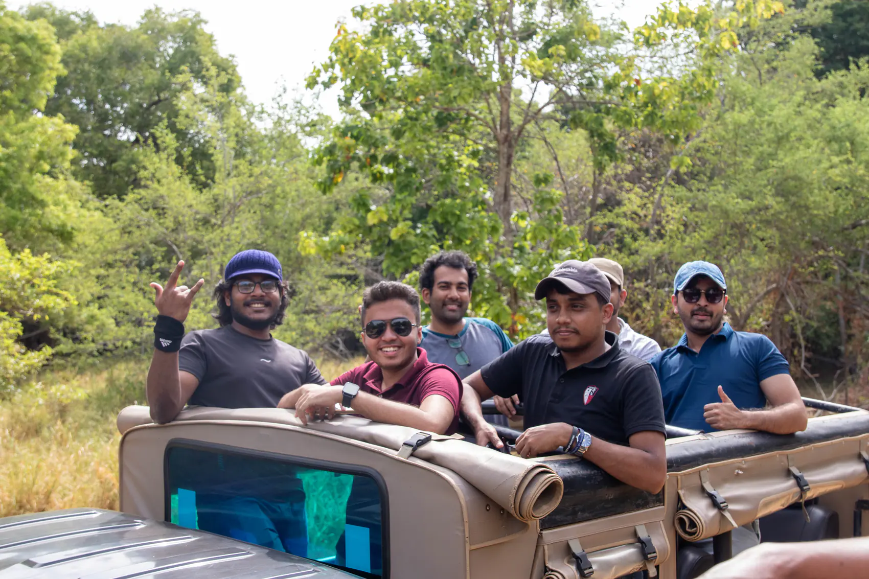 Women and a child enjoying the Minneriya safari together from their jeep