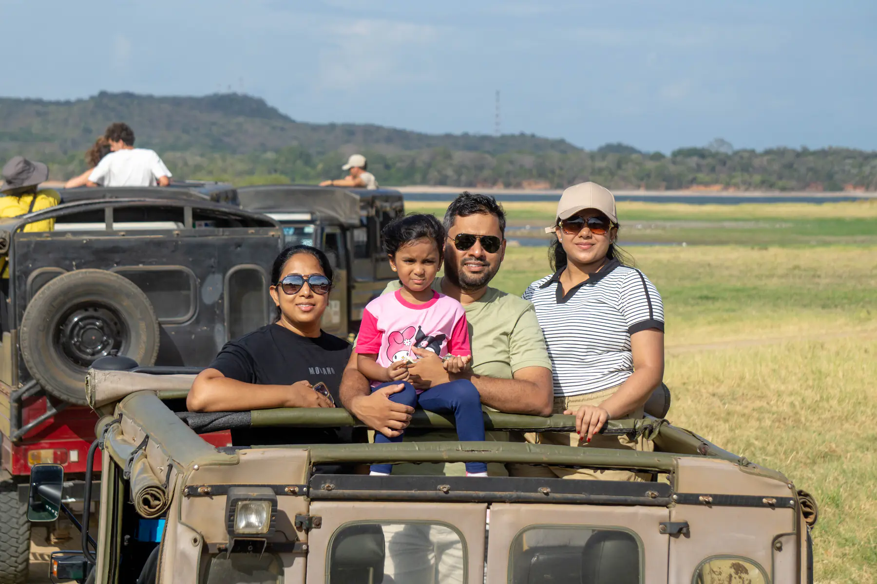 A family enjoying the Minneriya safari together from their jeep