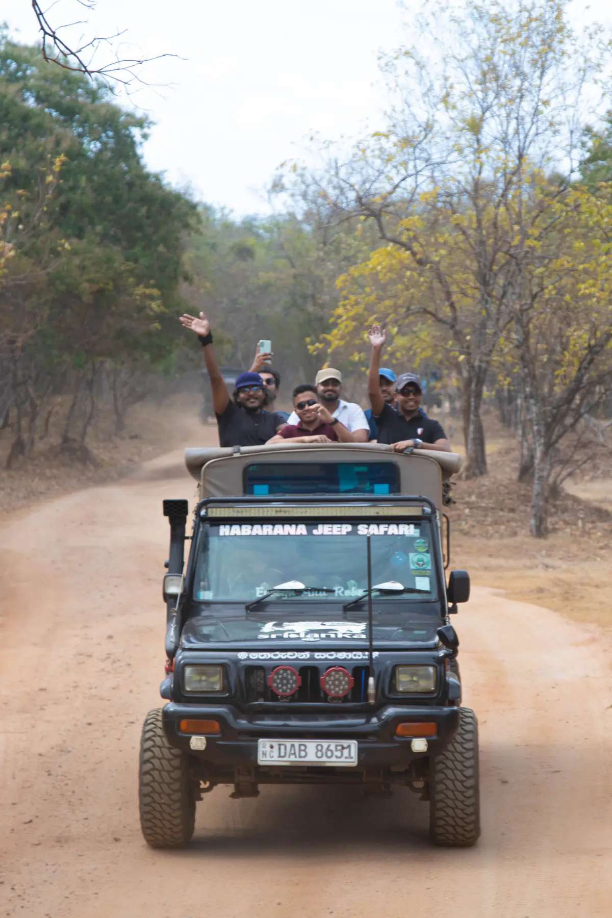 A safari jeep carrying the FACTn team along a forest track