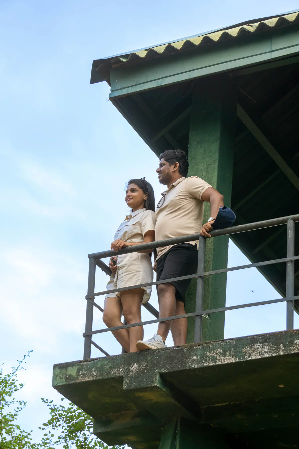 Guests looking out from a safari observation tower