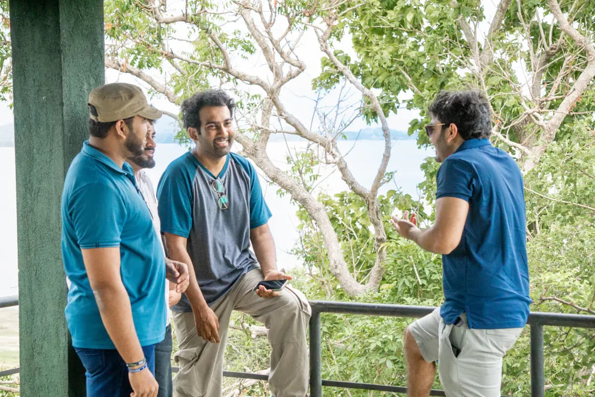 Three FACTn teammates sharing a conversation during the safari