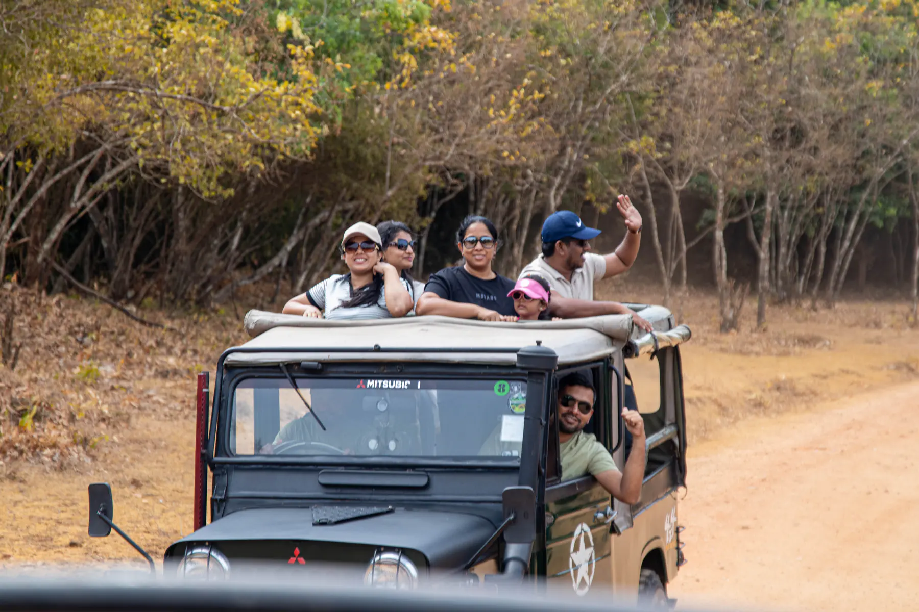 FACTn team members riding together through Minneriya in a safari jeep