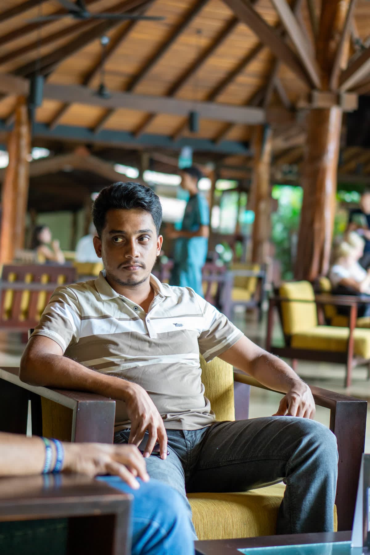 FACTn colleague seated in the open-air restaurant at Hotel Sigiriya