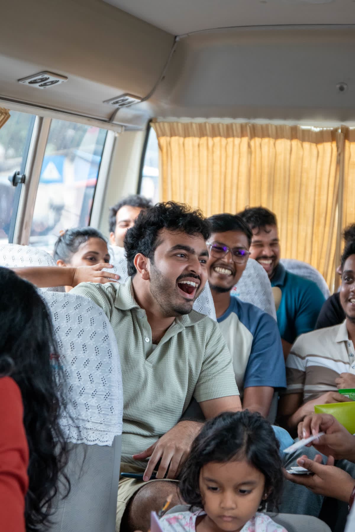 FACTn team members laughing together on the bus to Sigiriya