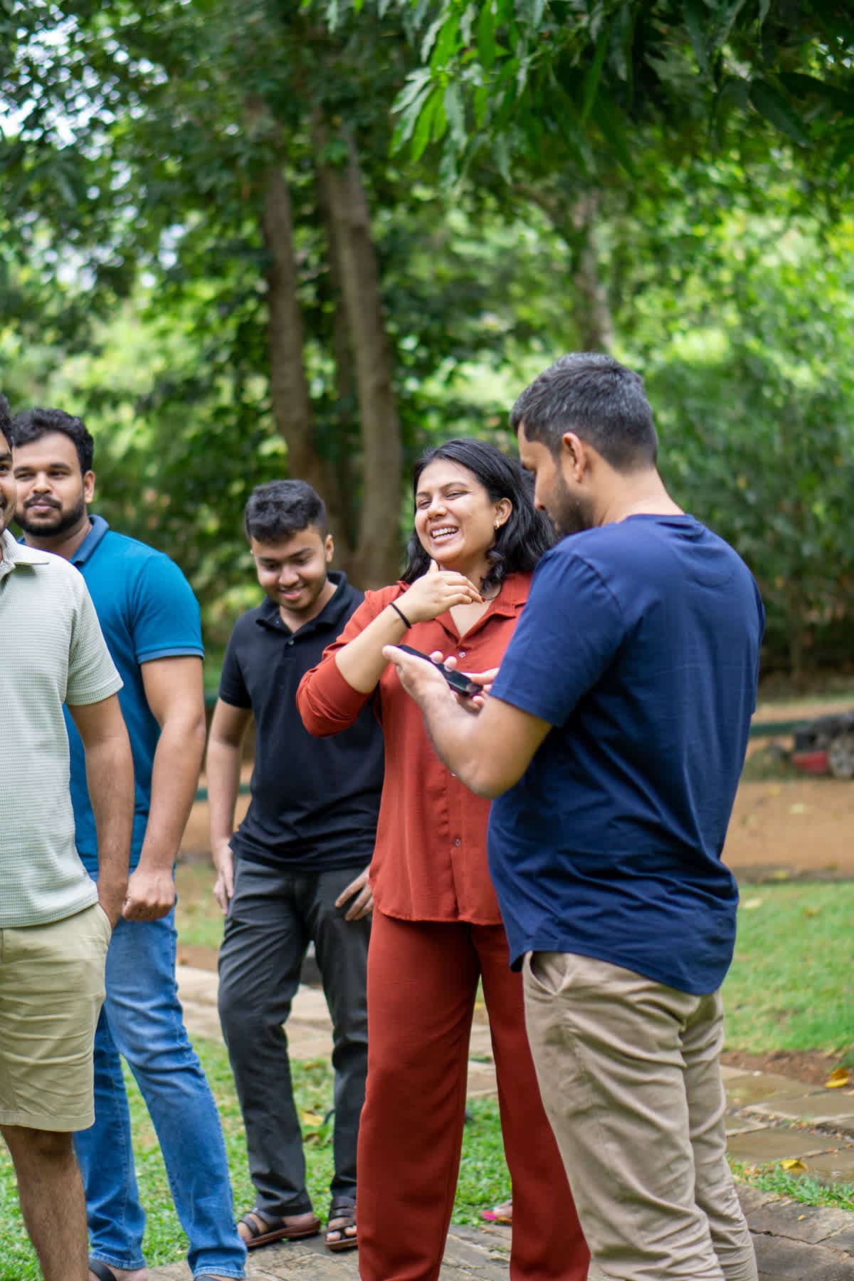 FACTn team members chatting together outdoors at Hotel Sigiriya