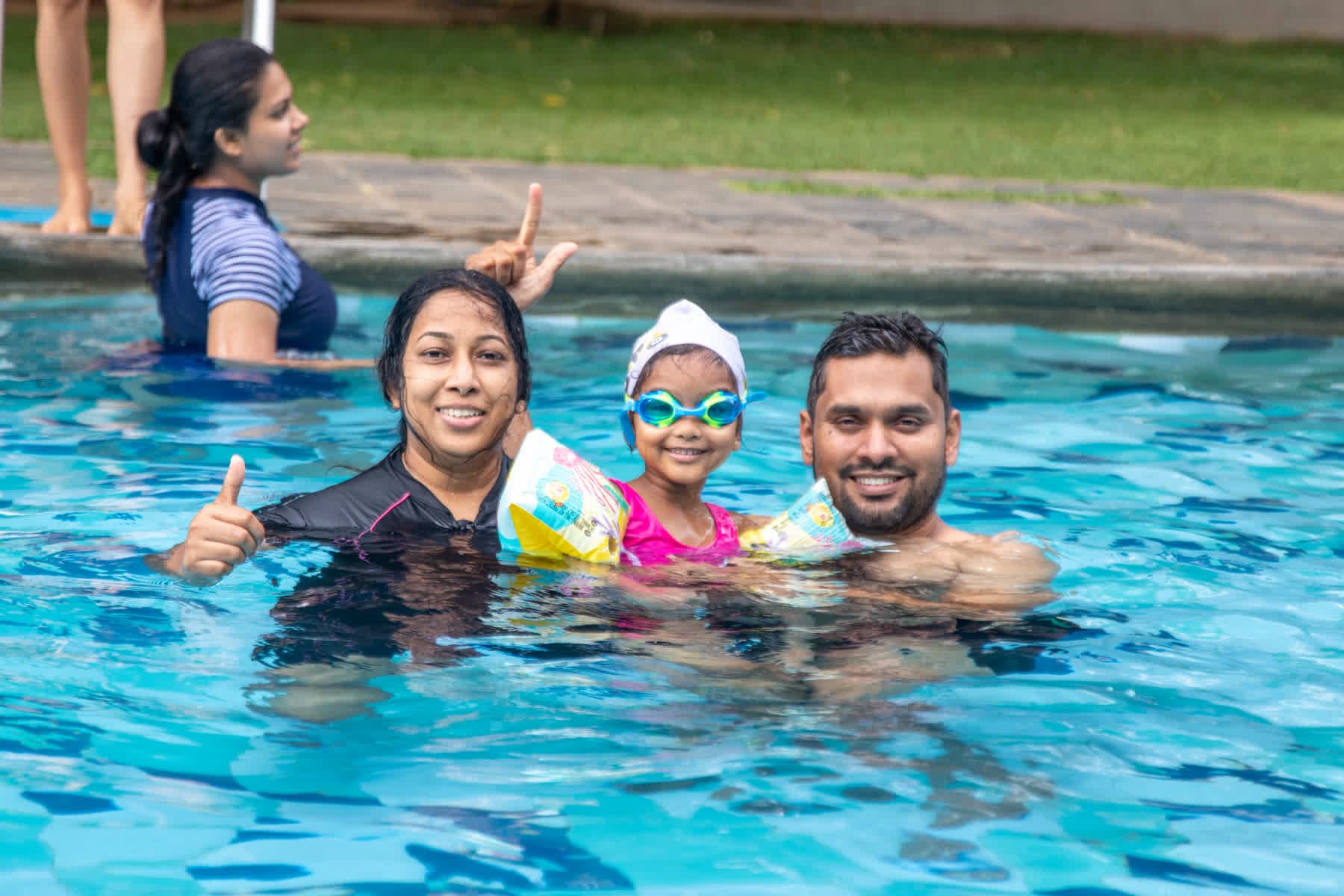 A family swimming together in the Hotel Sigiriya pool
