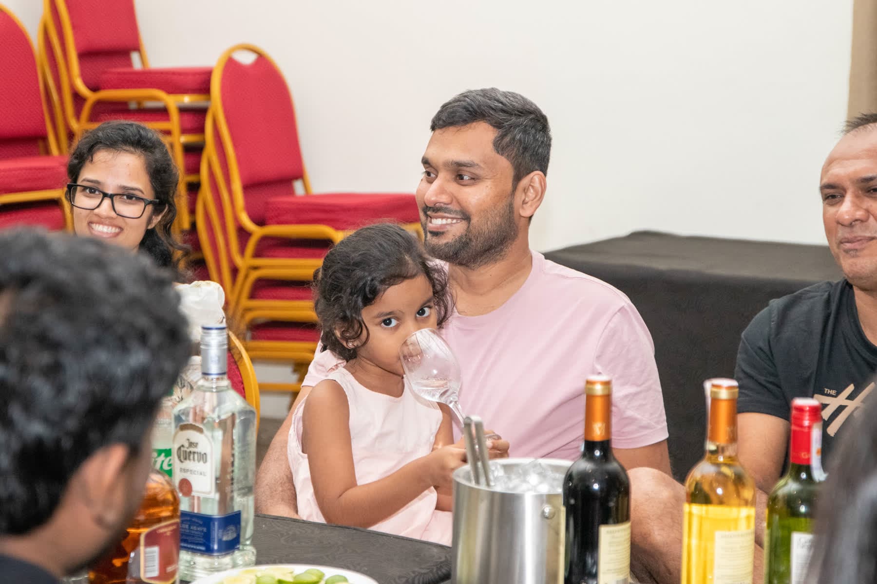 A father holding his daughter during the Northbound 26 evening gathering
