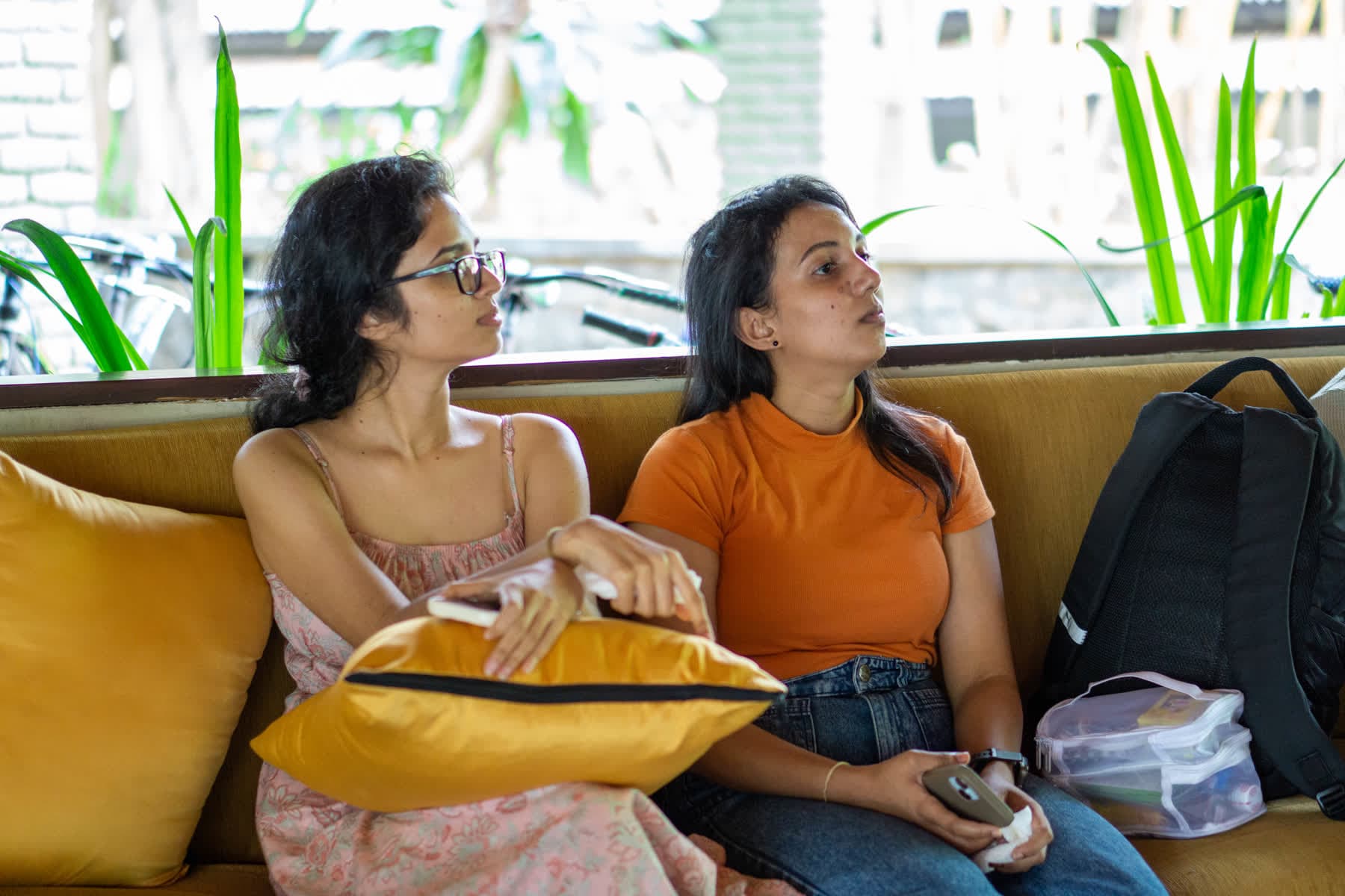 Two women relaxing together in a lounge at Hotel Sigiriya