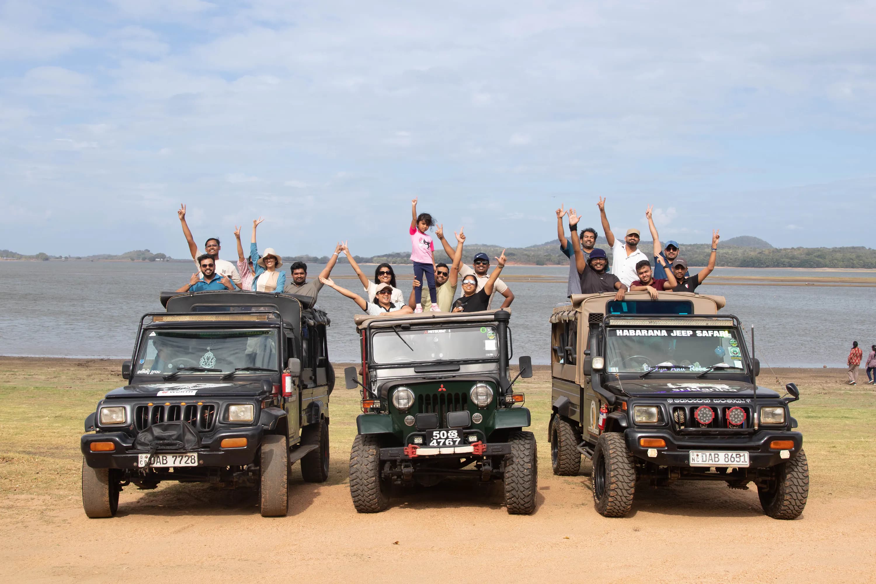 FACTn team celebrating together on jeeps during their Minneriya safari