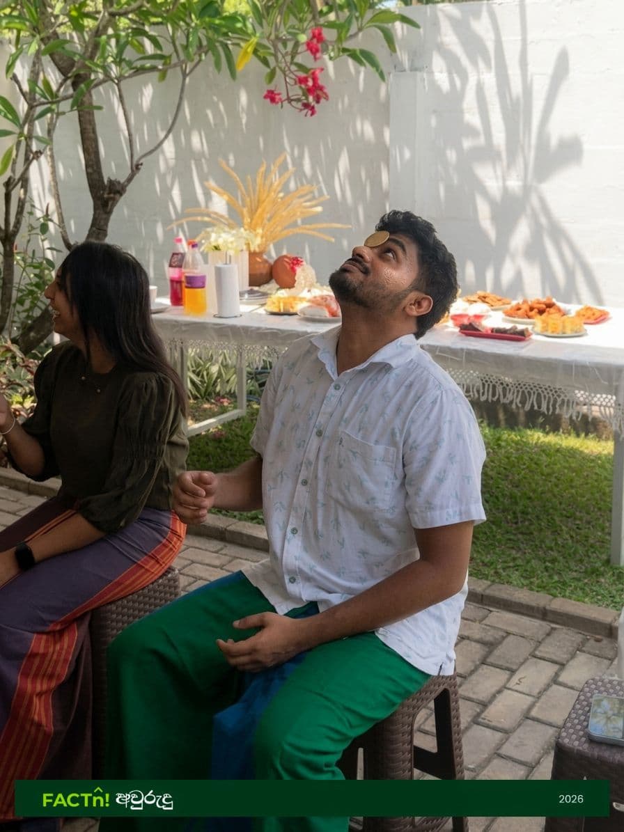 FACTn team member balancing a coin during an Avurudu party game