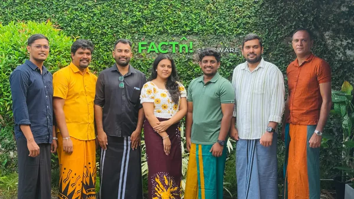 FACTn team members posing in traditional Avurudu outfits