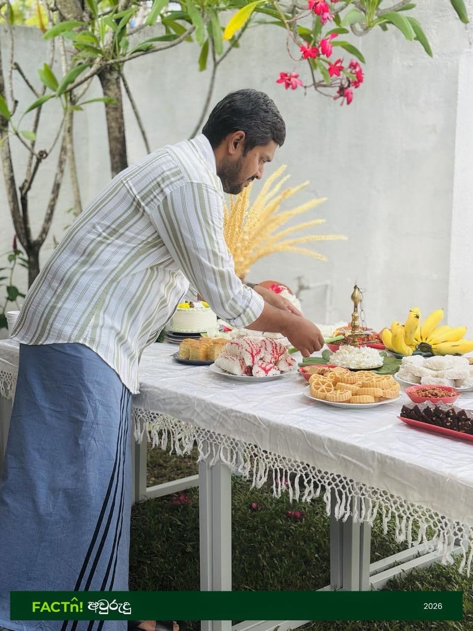 FACTn team member arranging traditional food for the Avurudu celebration