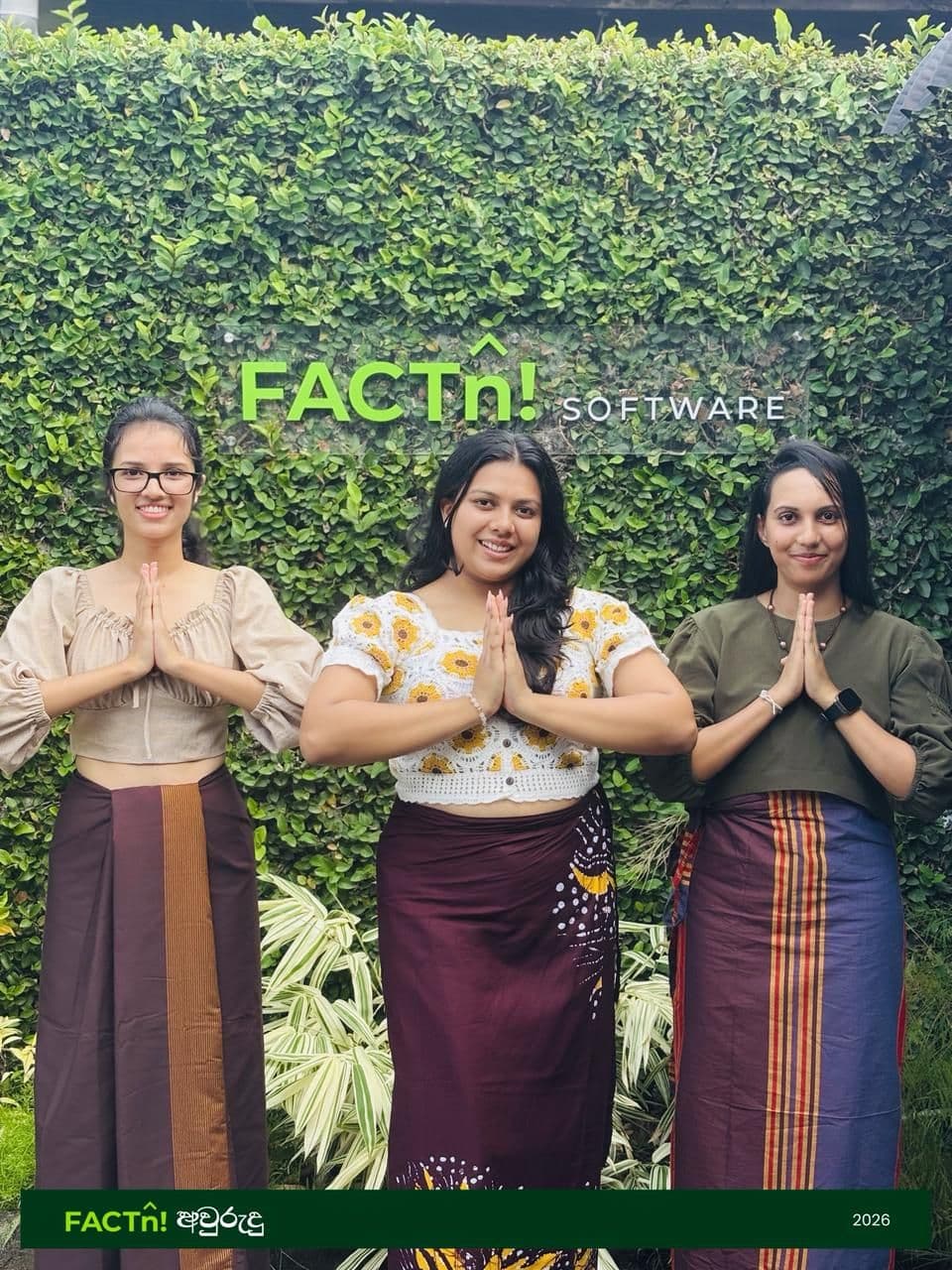 Three FACTn team members posing in traditional attire for Avurudu