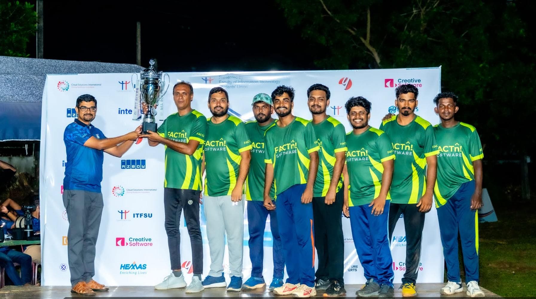 FACTn cricket team holding trophies at Fit Sixes
