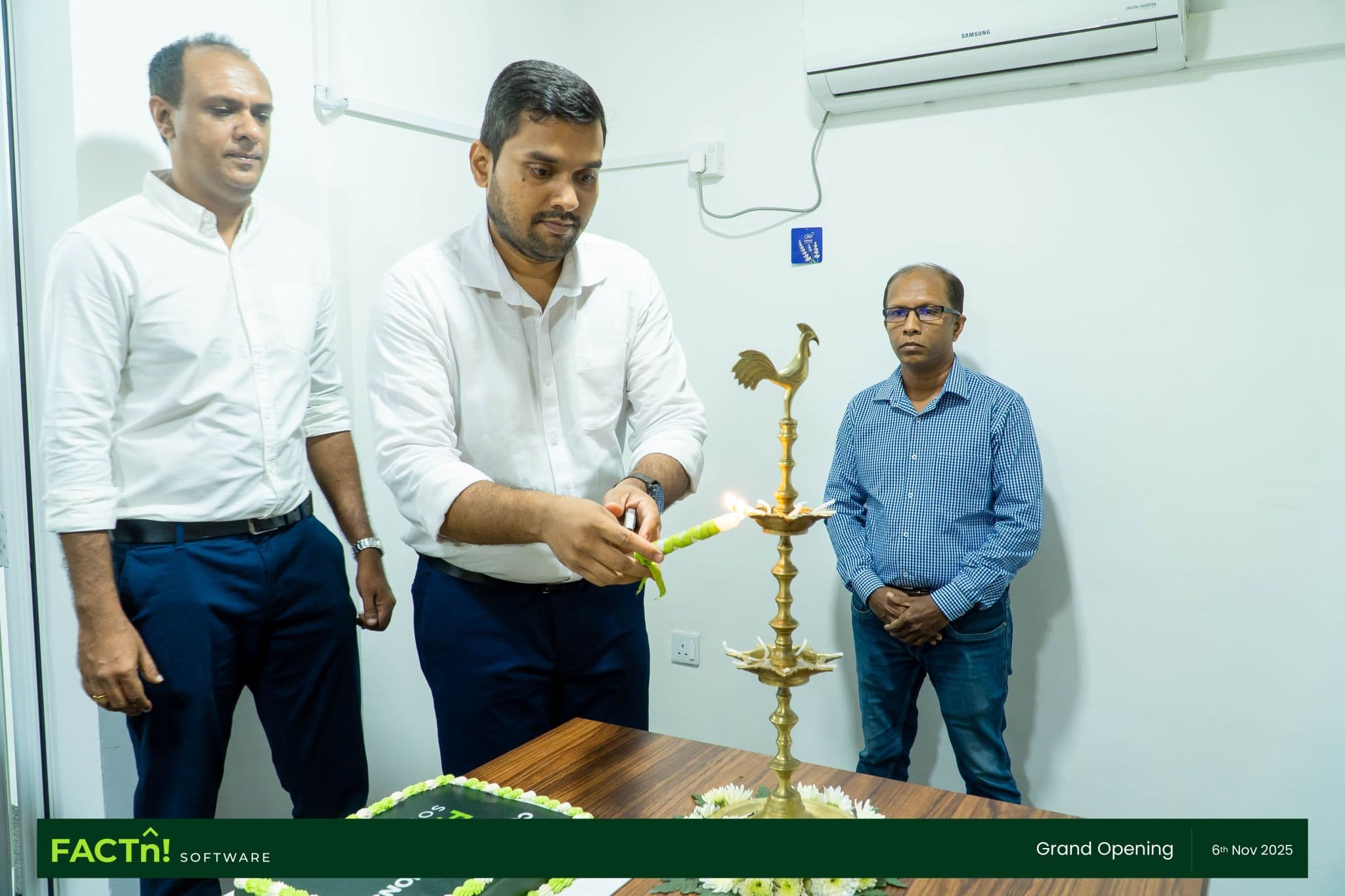 FACTn team members lighting the ceremonial oil lamp at the new office opening