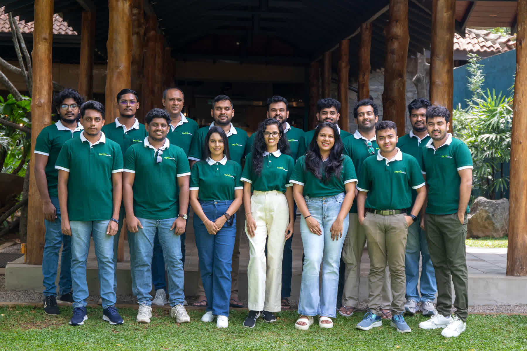 FACTn Software team in matching green shirts outside Hotel Sigiriya