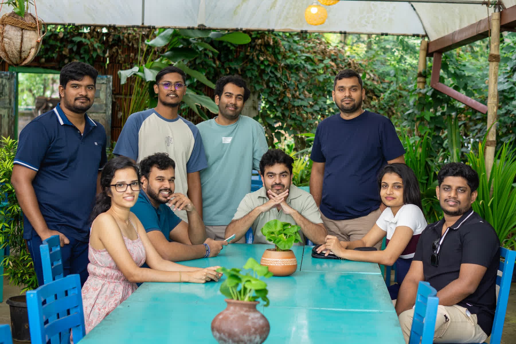 FACTn team gathered around an outdoor table at Hotel Sigiriya